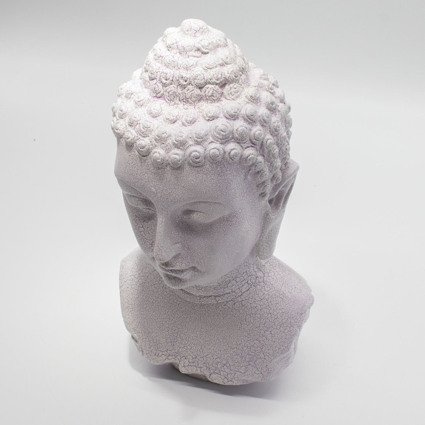Buddha Bust Lamp with crackle textured surface on modern oval stand