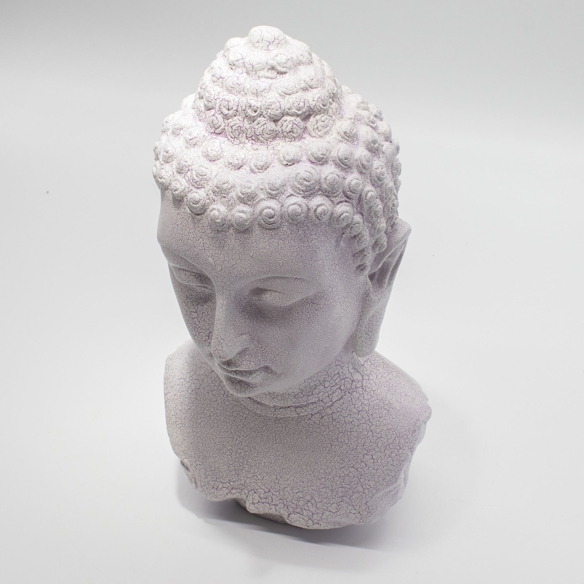 Buddha Bust Lamp with crackle textured surface on modern oval stand