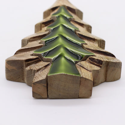 Decorative item with green tree design on wooden blocks