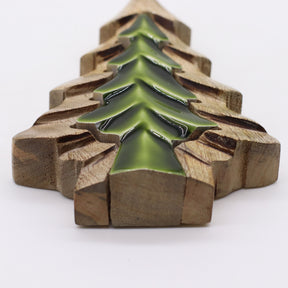 Decorative item with green tree design on wooden blocks