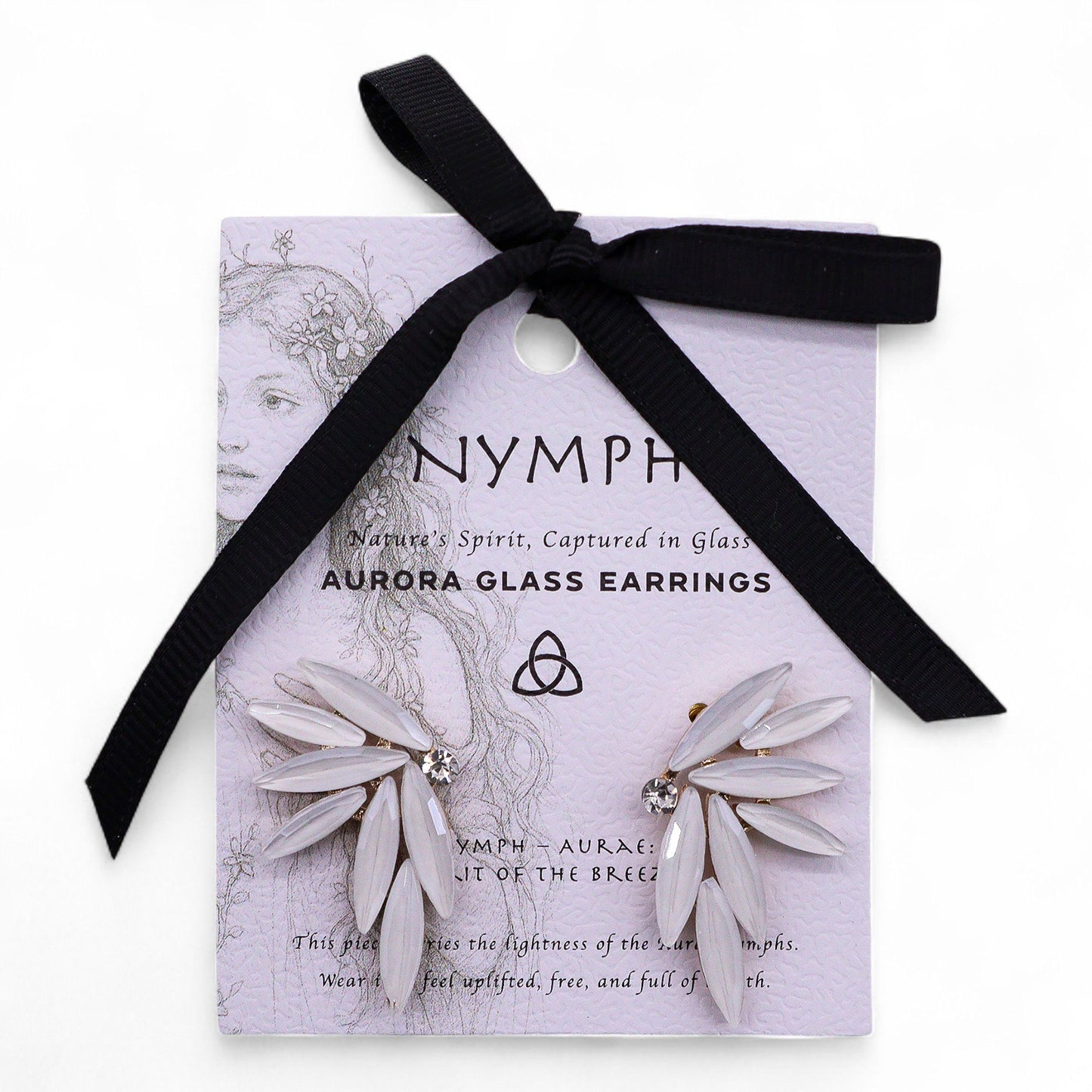 Pearl-white vintage glass fairy wing earrings catching soft dawn light, styled with white feathers and morning mist