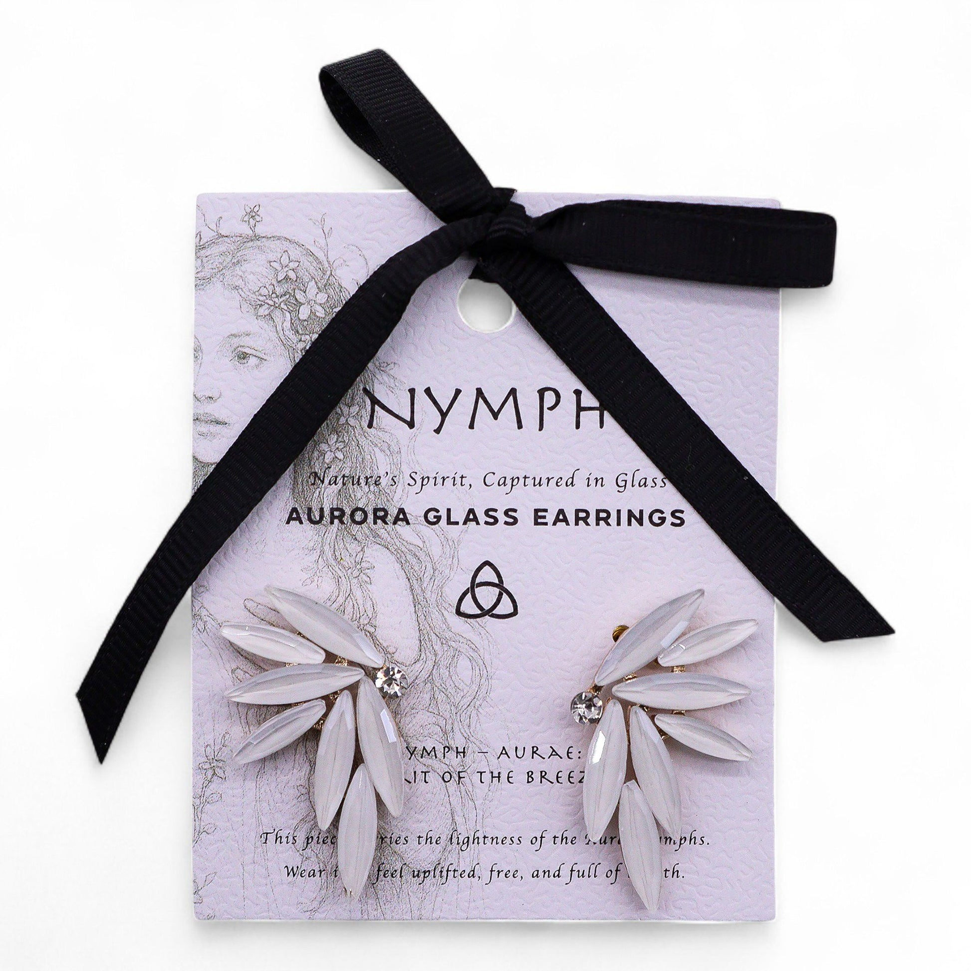Pearl-white vintage glass fairy wing earrings catching soft dawn light, styled with white feathers and morning mist