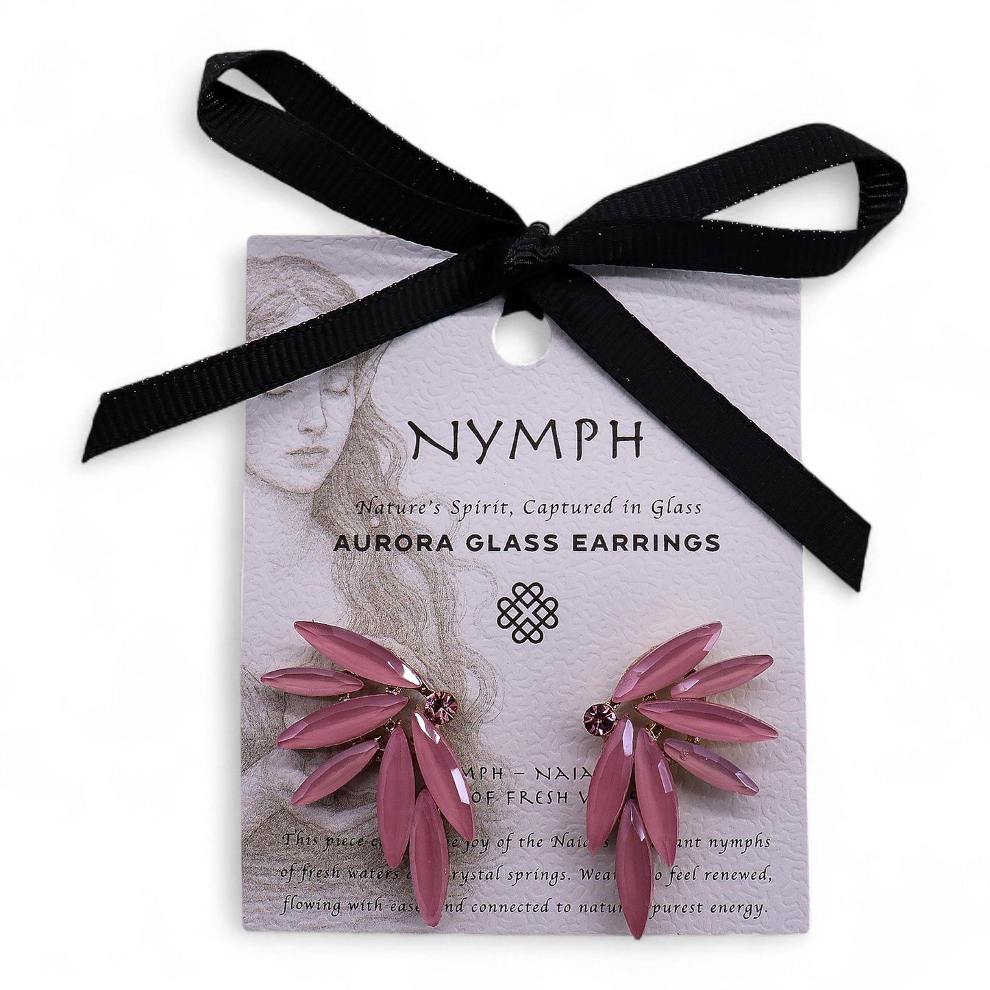 Soft pink vintage glass fairy wing earrings catching gentle light, styled beside a crystal-clear stream with rose petals floating on water