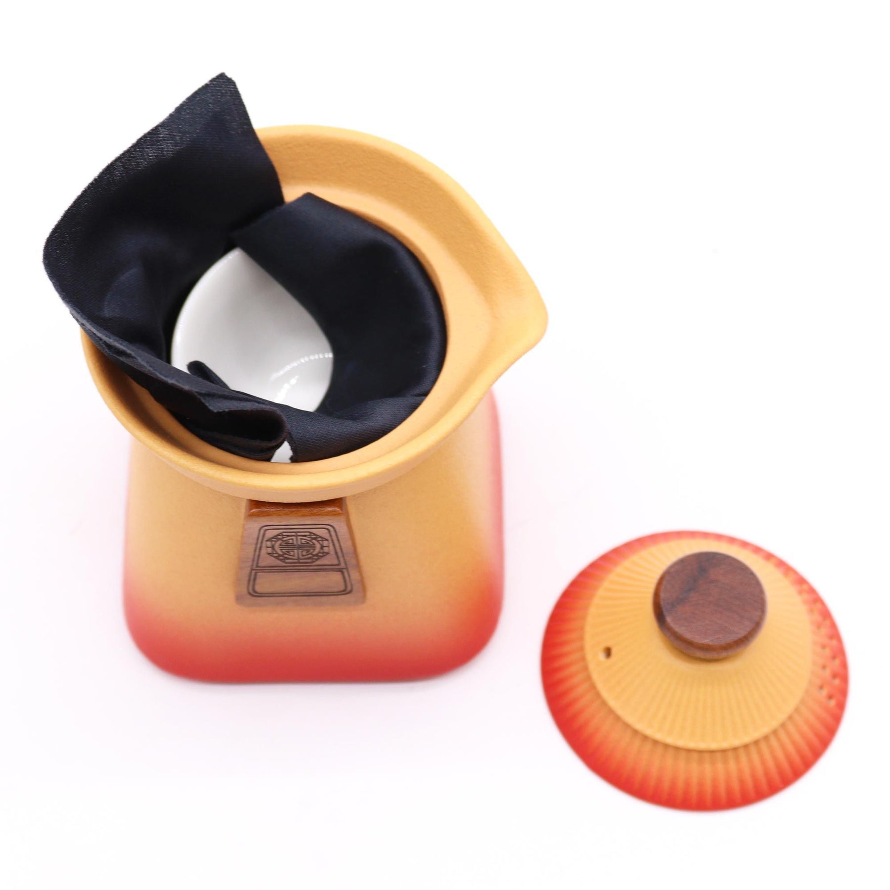 Temple Teapot Set in warm Orange Earth design with three cups fitting inside for easy transportation