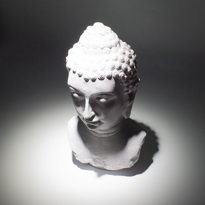 Buddha Bust Lamp with crackle textured surface on modern oval stand