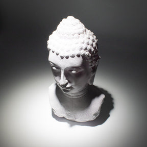 Buddha Bust Lamp with crackle textured surface on modern oval stand