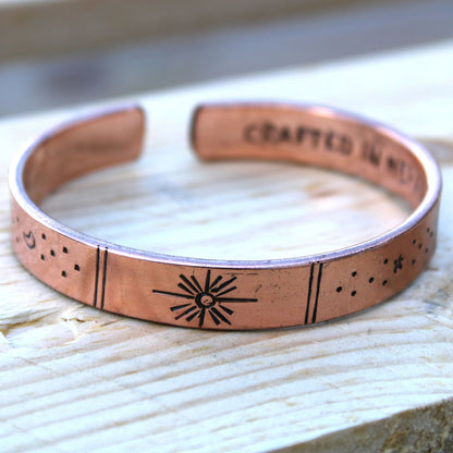 Hand-hammered brass galaxy cuff from Nepal with secret inner mantra (Dream Big, Reach For The Stars & more). Stars & Earth design outside. Fair-trade, adjustable, gift-ready with story card