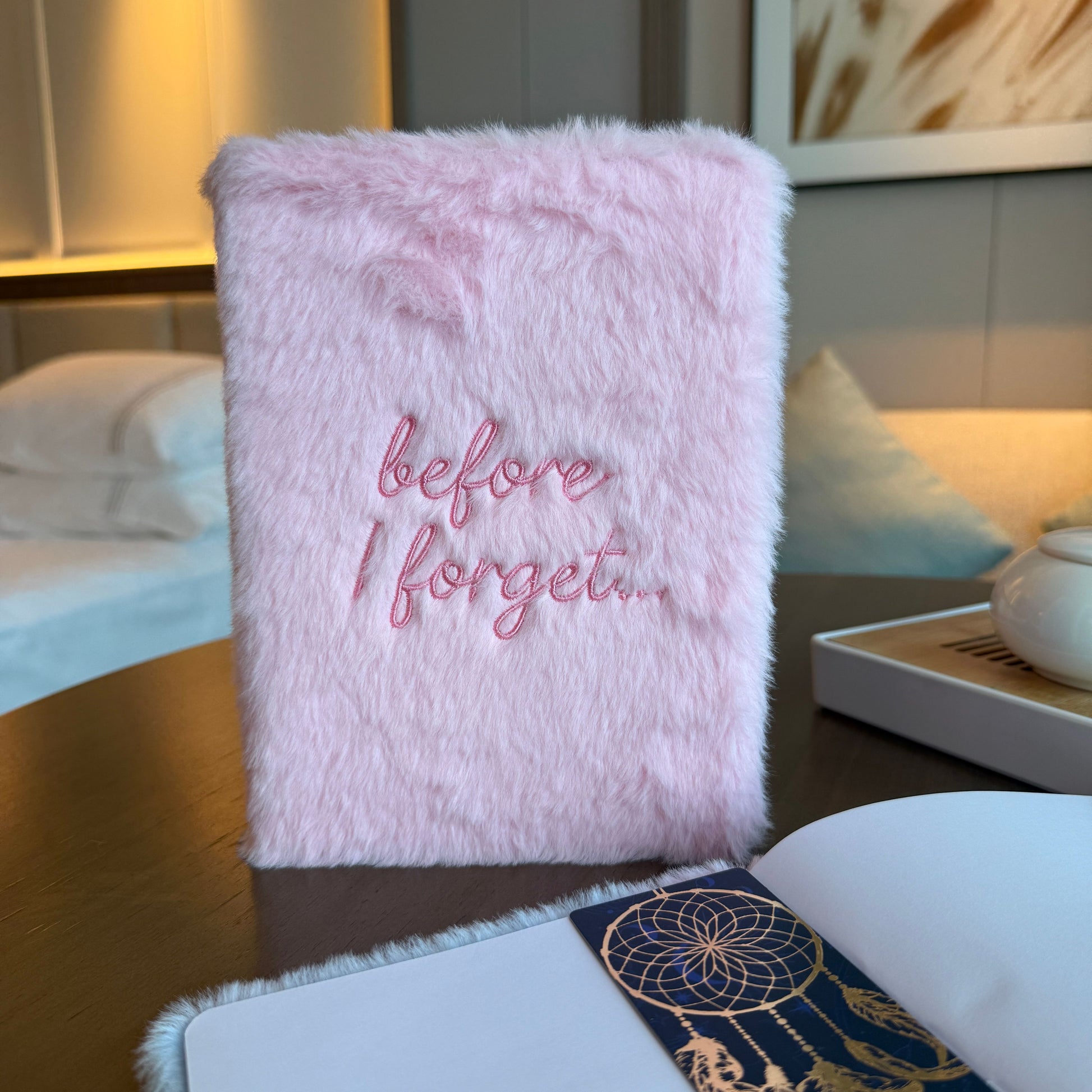 Pink fluffy notebook with 'before I forget...' text