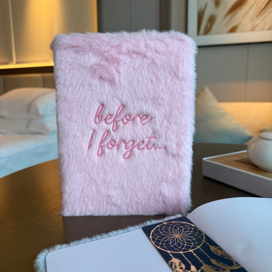 Pink fluffy notebook with 'before I forget...' text