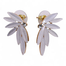 Pearl-white vintage glass fairy wing earrings catching soft dawn light, styled with white feathers and morning mist