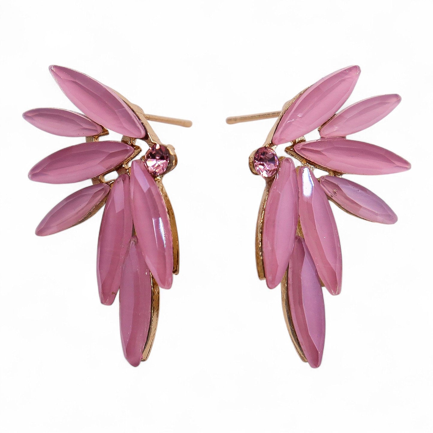 Soft pink vintage glass fairy wing earrings catching gentle light, styled beside a crystal-clear stream with rose petals floating on water