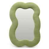 Soft squiggly large cloud mirror in earthy moss green velvet frame with organic curved silhouette