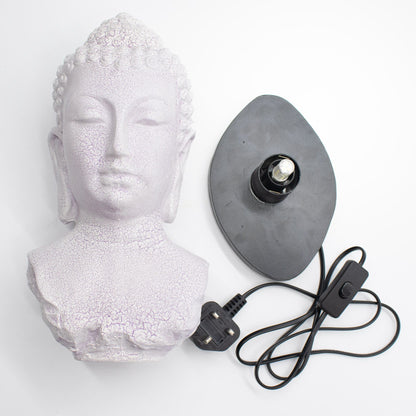 Buddha Bust Lamp with crackle textured surface on modern oval stand with power cord and plug