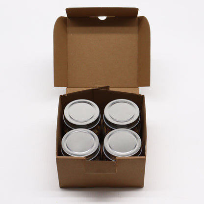 Four metal cans in a brown cardboard box on a white background