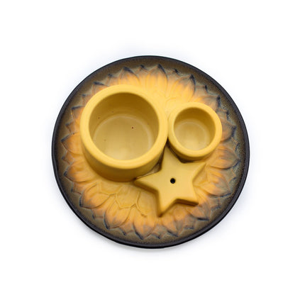 Yellow ceramic incense holder with star design