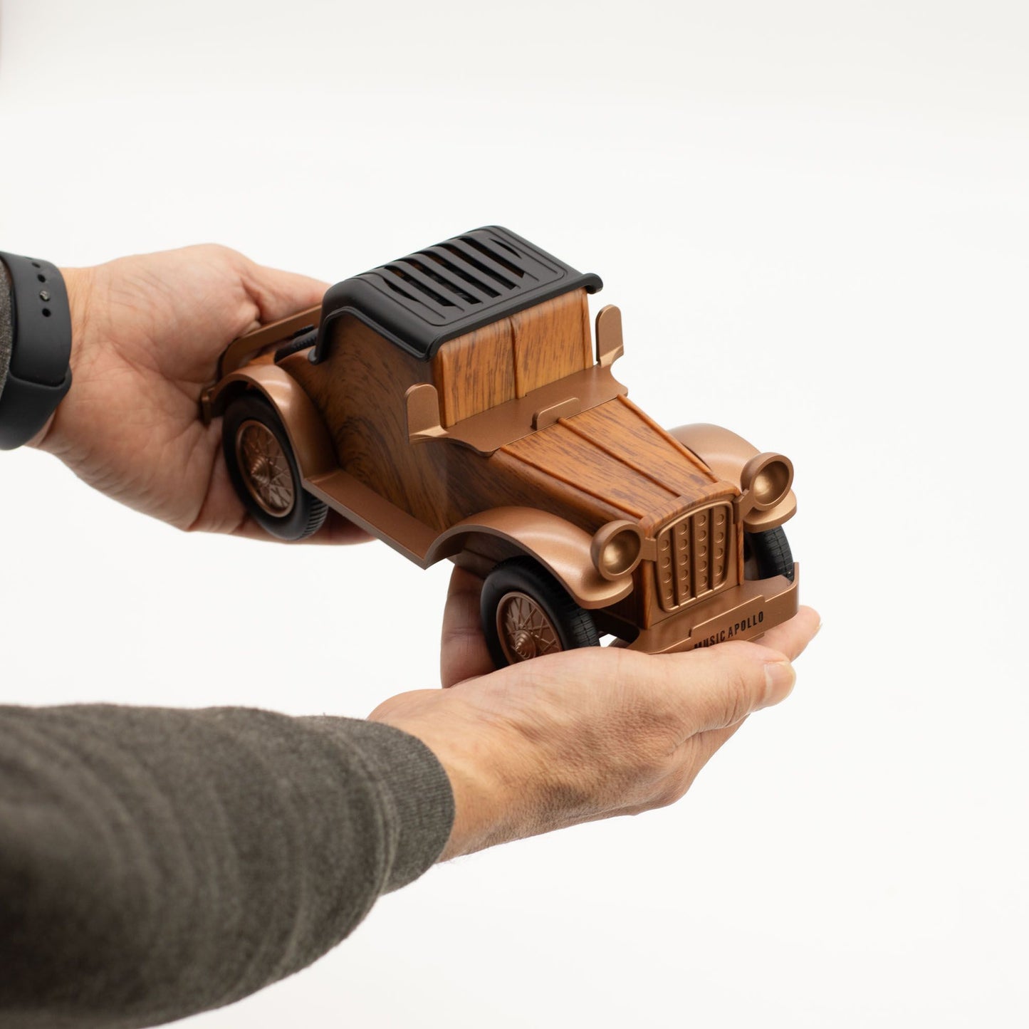 Vintage car speaker held by a person's hand