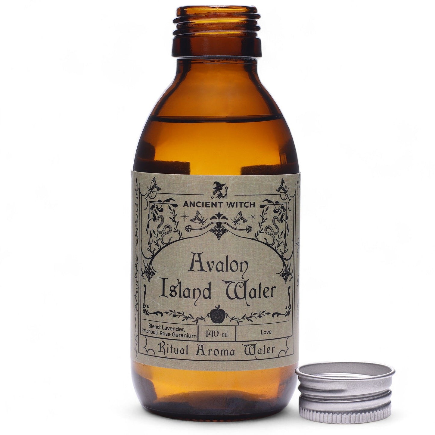 140ml amber bottle of Avalon Island ritual water with misty isle & nine priestesses label, surrounded by fresh lavender, roses and glowing candles