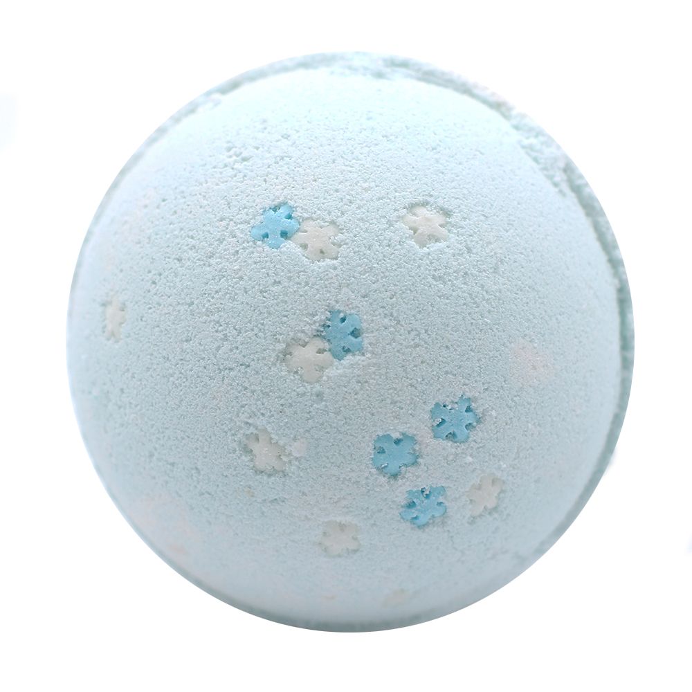 Giant blue snowflake bath bomb 180g topped with biodegradable glitter on frosty white background with blueberries