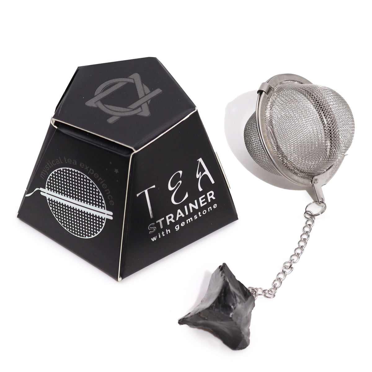 Tea strainer with gemstones in a black geometric packaging on a white background