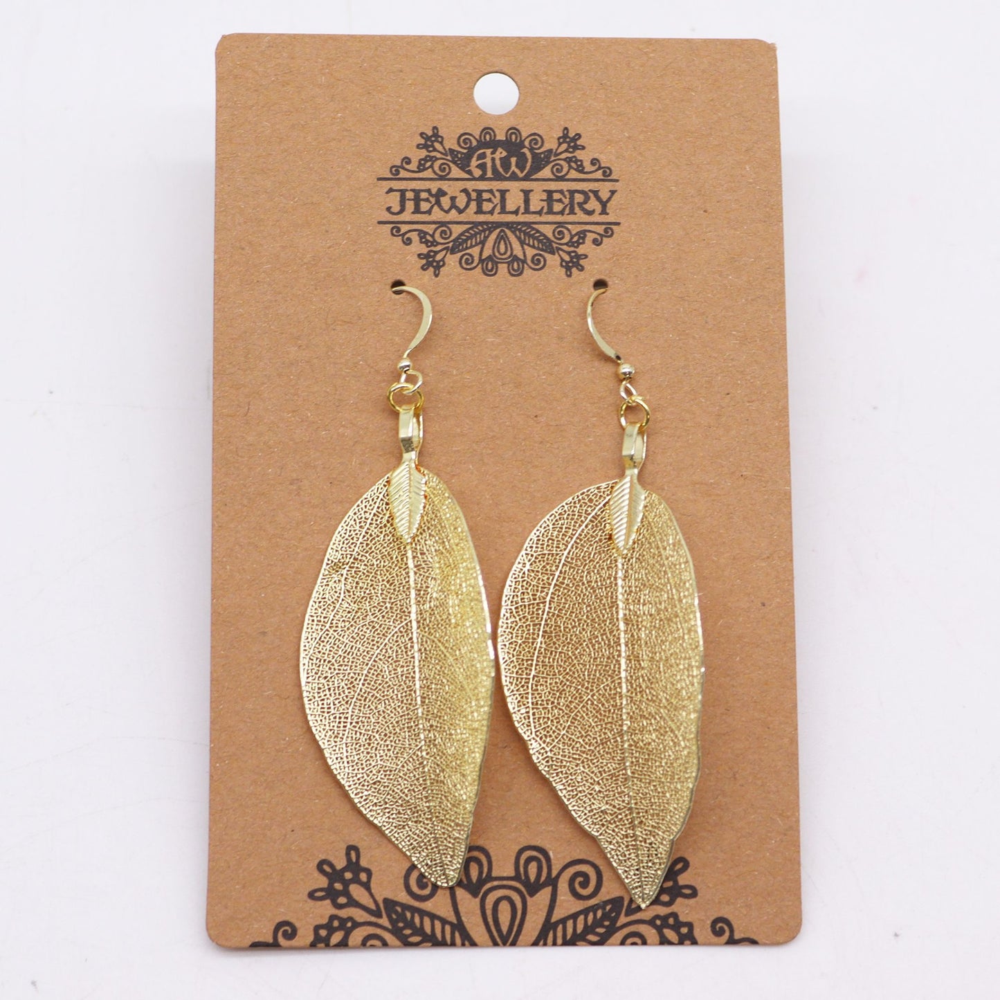 Gold leaf-shaped earrings on a 'Jewellery' branded card.