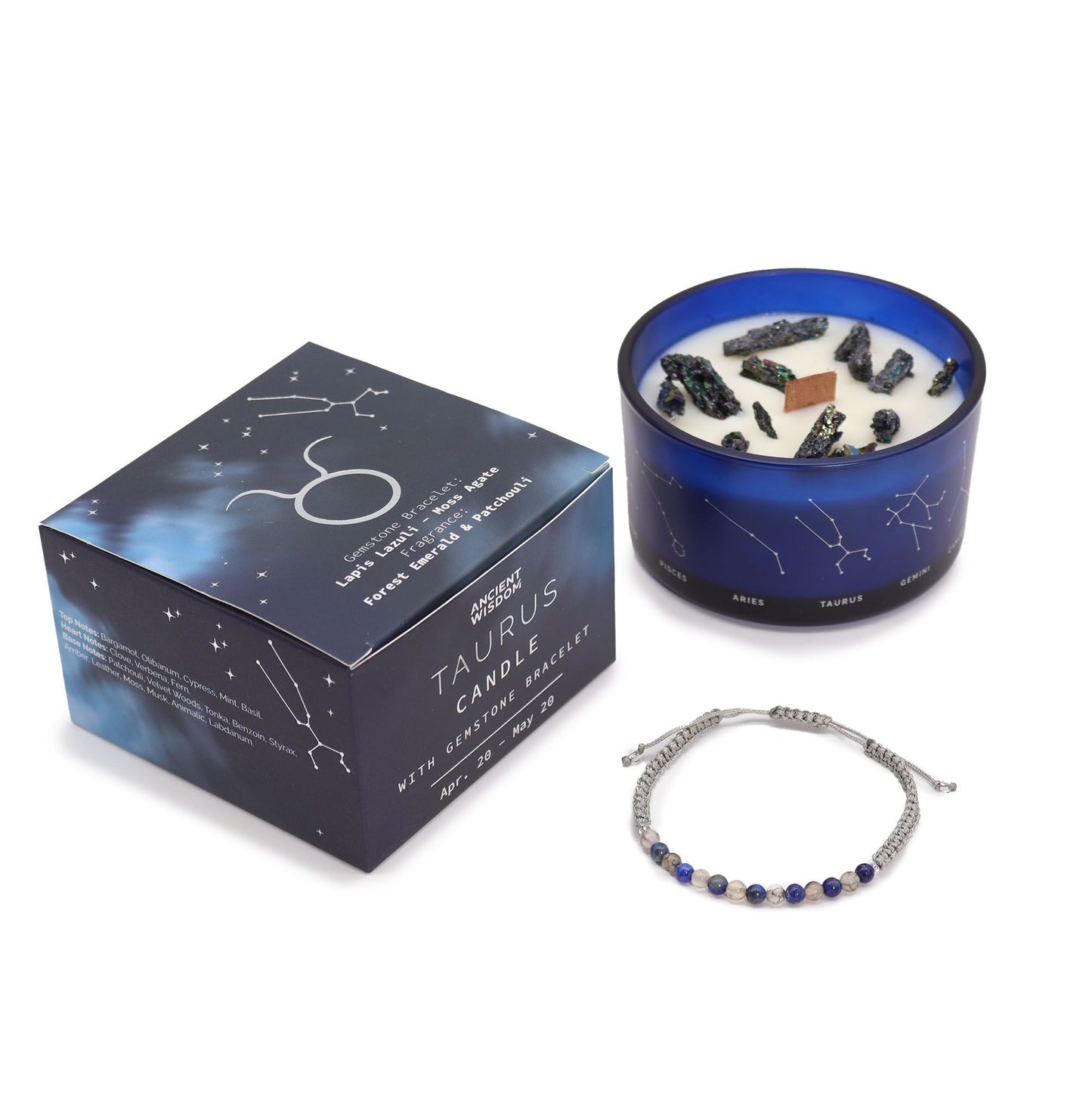 Earthy green Taurus zodiac candle burning beside matching lapis lazuli & moss agate bracelet, styled with bull symbol, ferns and Taurus constellation card