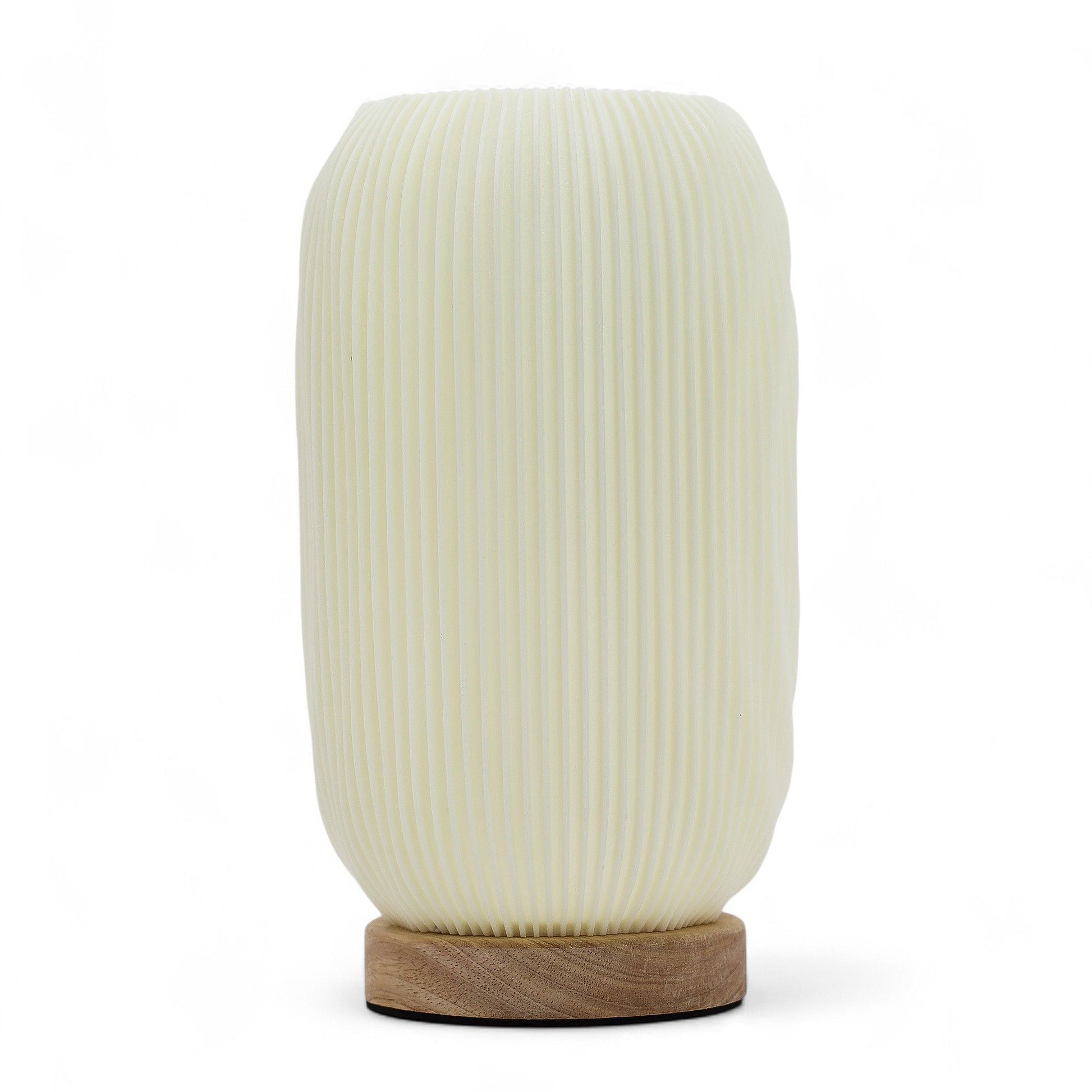 Modern Twisted New Wave USB lamp with textured honeycomb surface and sleek twisted silhouette, warm glow on 3rd brightness setting, placed on wooden base