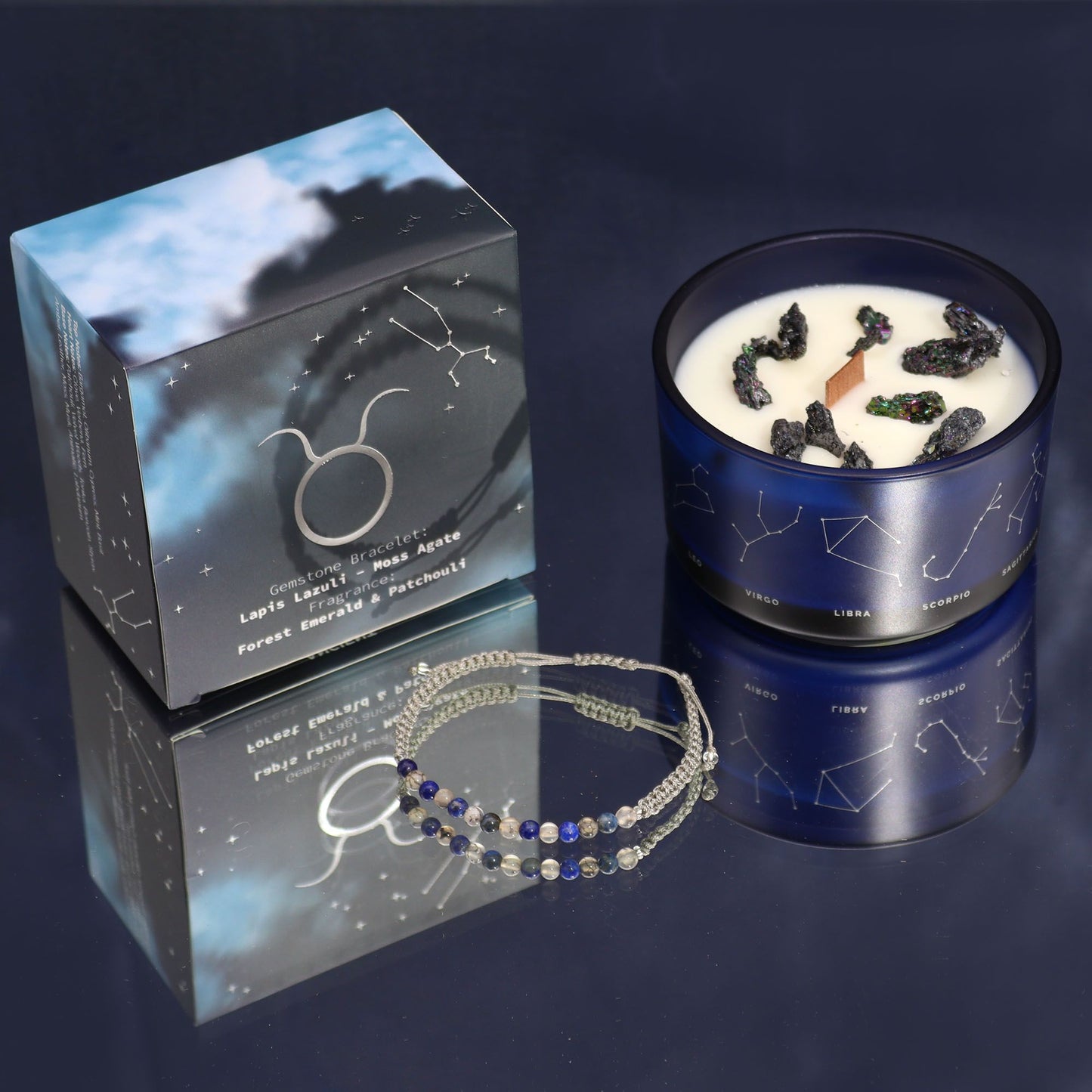 Candle with decorative elements and packaging on a dark background