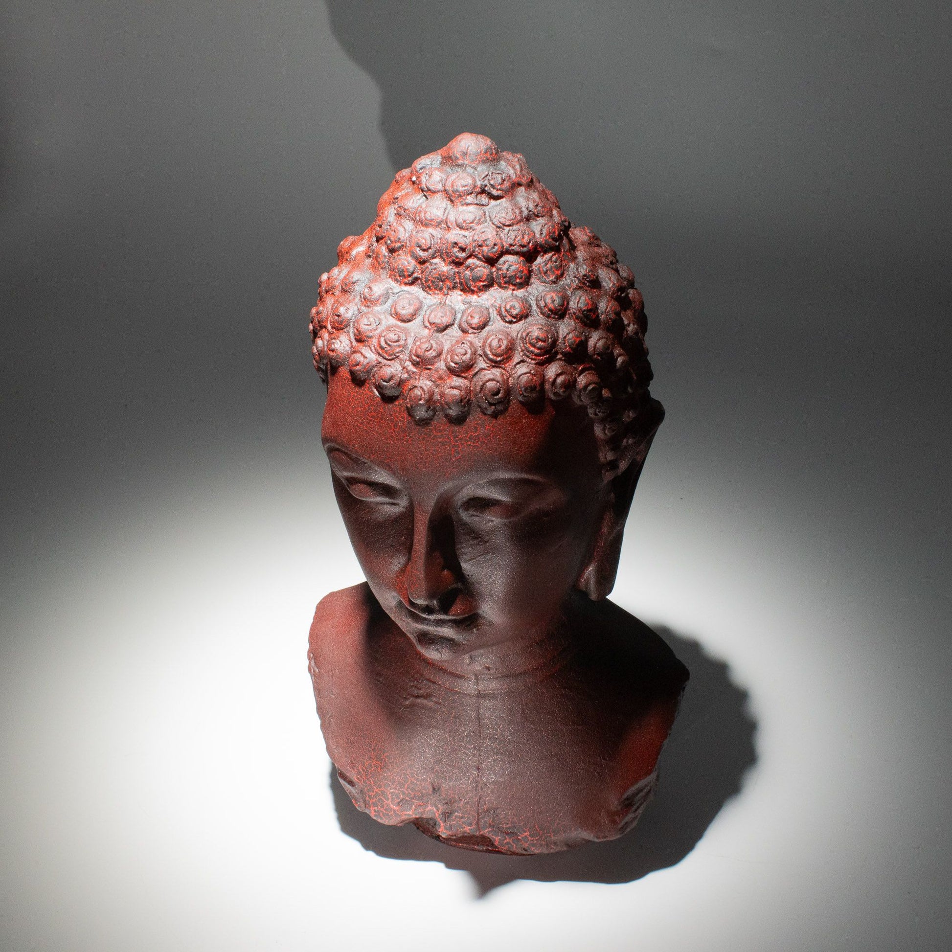 Buddha Bust Lamp with crackle textured surface on modern oval stand