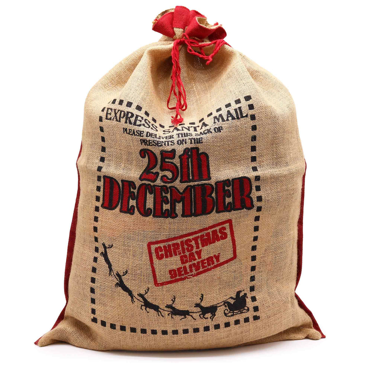 Large jute Christmas sack filled with wrapped presents under tree, stamped “Express Delivery 25th December” with black reindeer and red ribbon tie