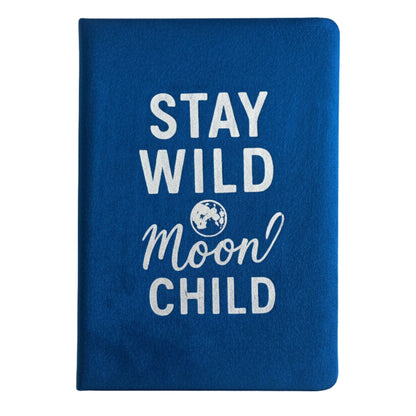 Deep blue velvet notebook with glowing silver “Stay Wild Moon Child” script
