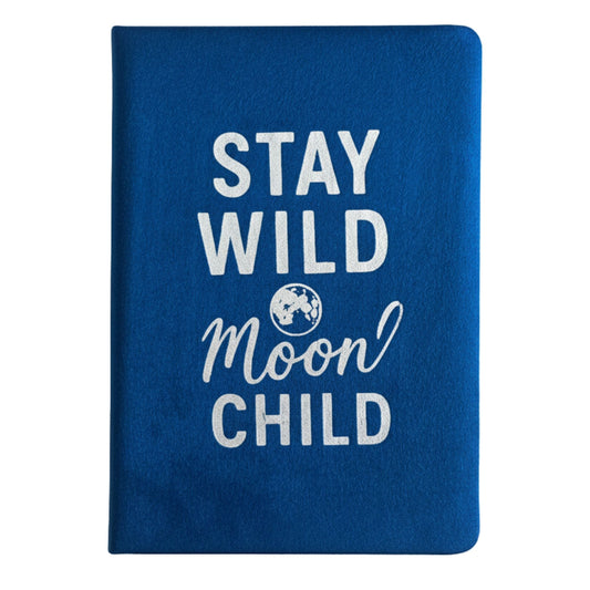 Deep blue velvet notebook with glowing silver “Stay Wild Moon Child” script