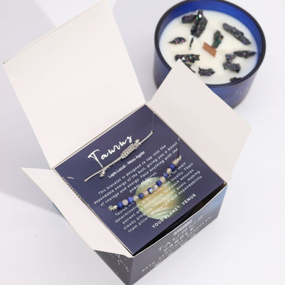 Necklace in a box with a candle in the background