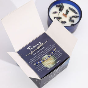 Necklace in a box with a candle in the background