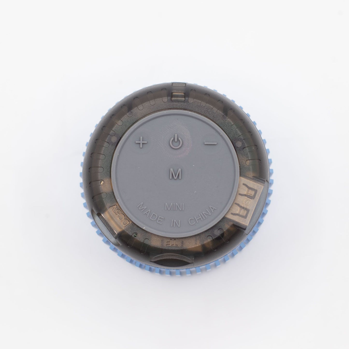 Close-up of Mint Rock speaker showing 5W driver grille, top controls (play/pause, volume) and mint finish details
