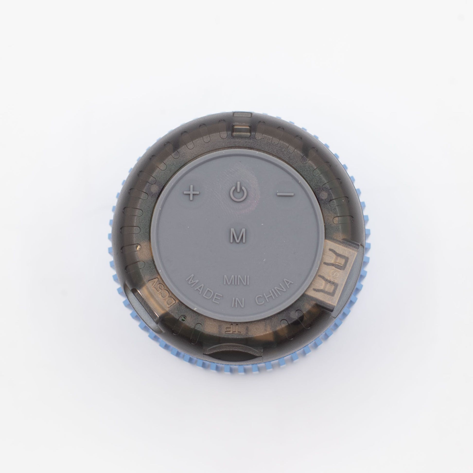 Close-up of Mint Rock speaker showing 5W driver grille, top controls (play/pause, volume) and mint finish details