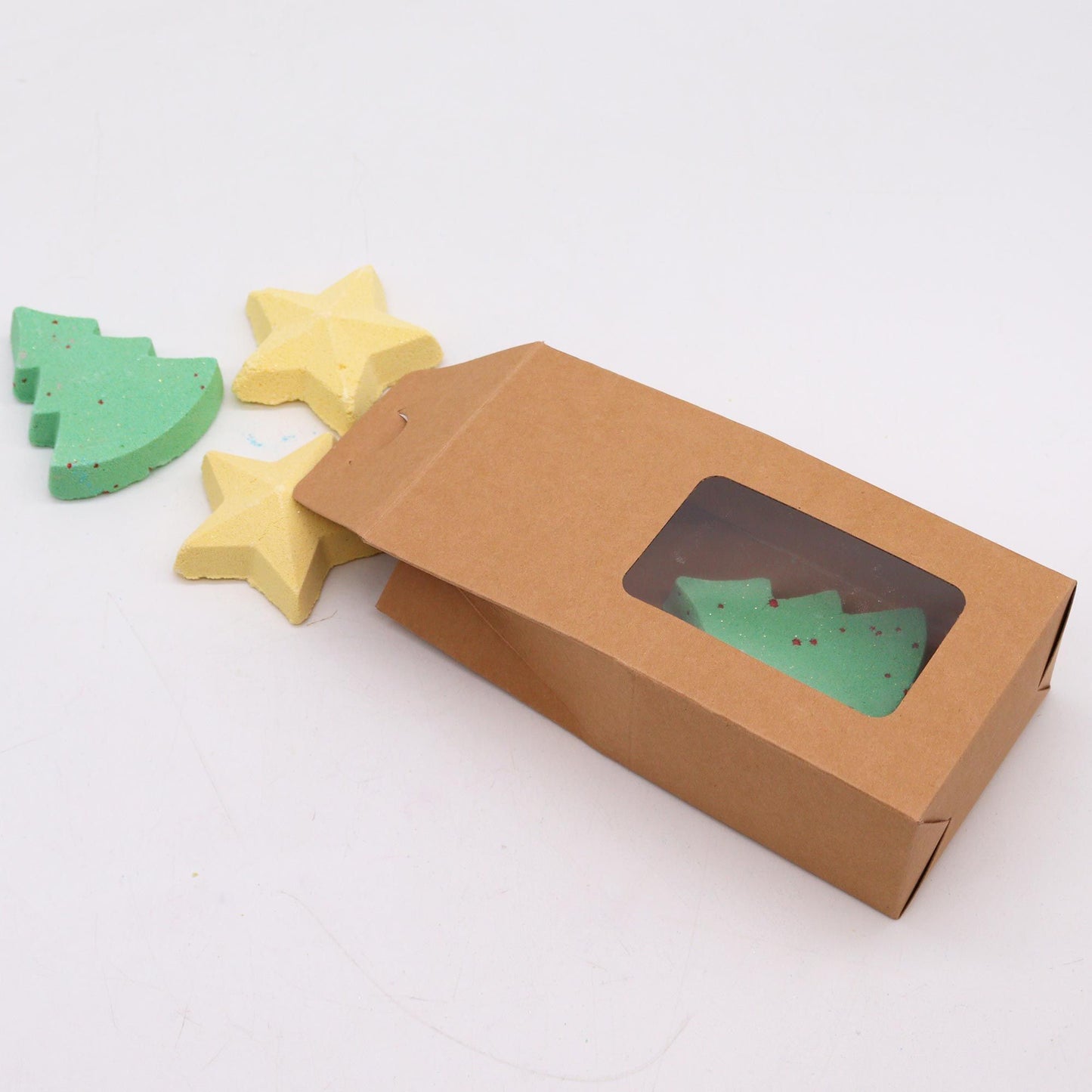 Silent Night Christmas bath bomb gift set with 2 green tree bath bombs and 2 gold star bath bombs in festive kraft gift box with ribbon