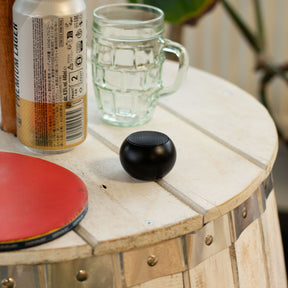 Beyond Size speaker placed on desk, playing music with Bluetooth 5.0 connection visible