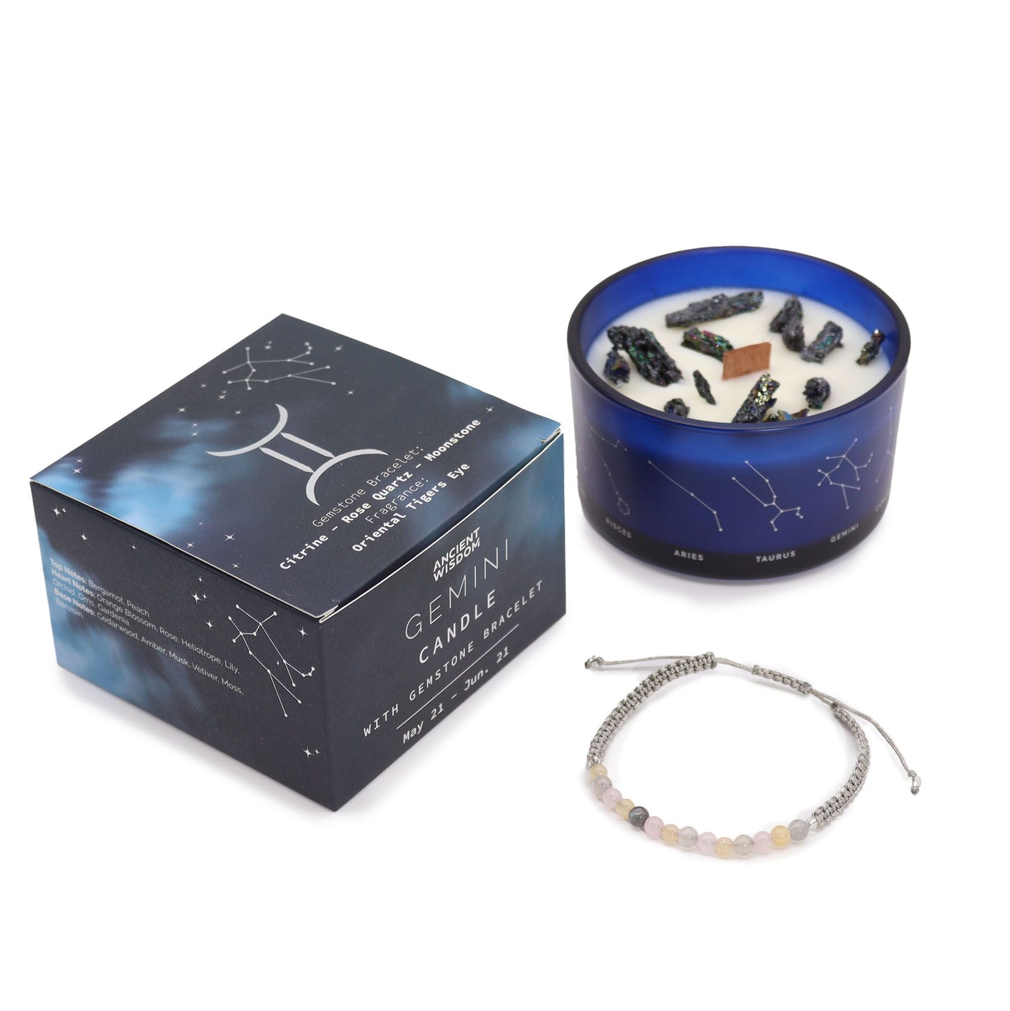 Gemini candle with gemstones and packaging on a white background