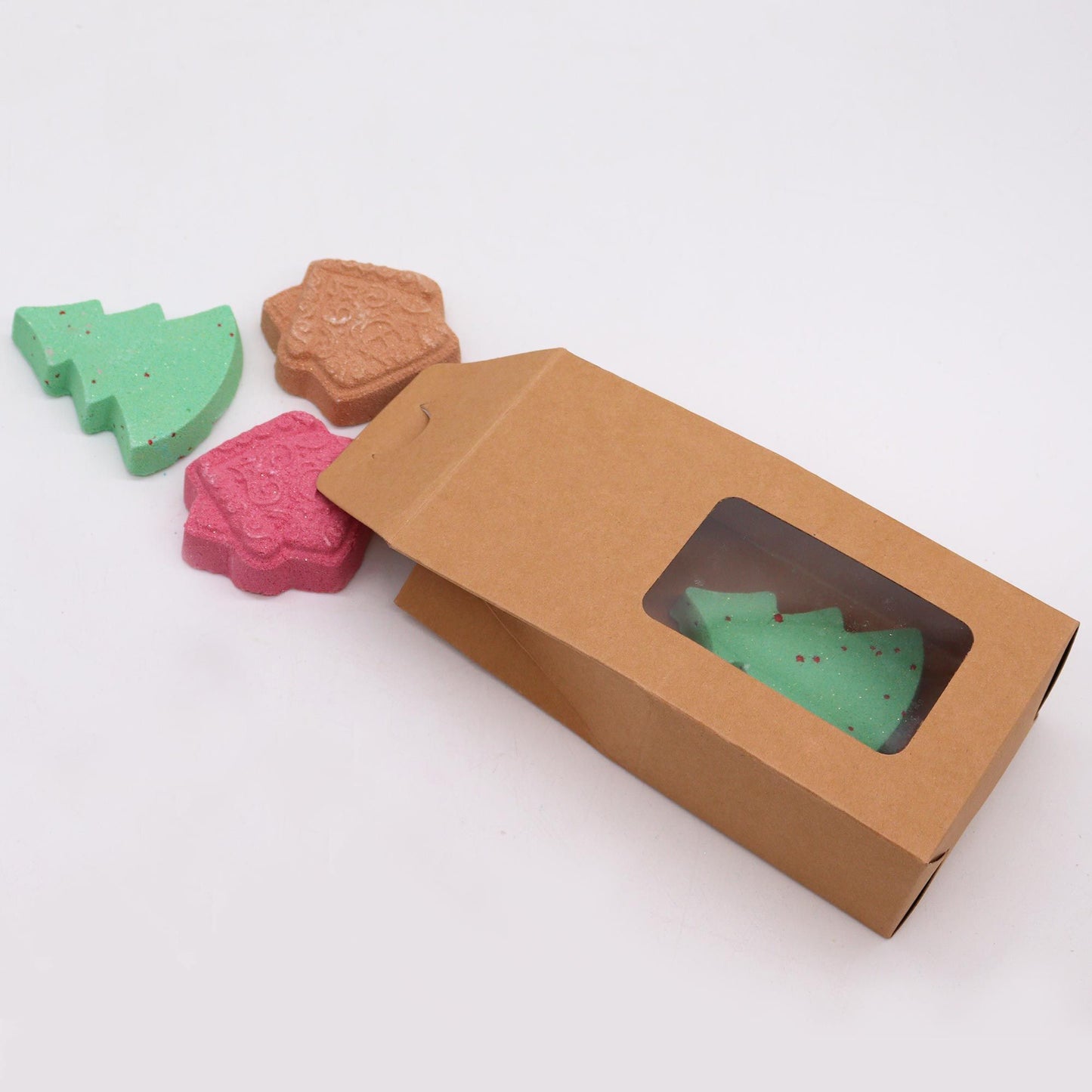 Gingerbread Town Christmas bath bomb gift pack with green tree and iced gingerbread house bath bombs in festive kraft box with red ribbon