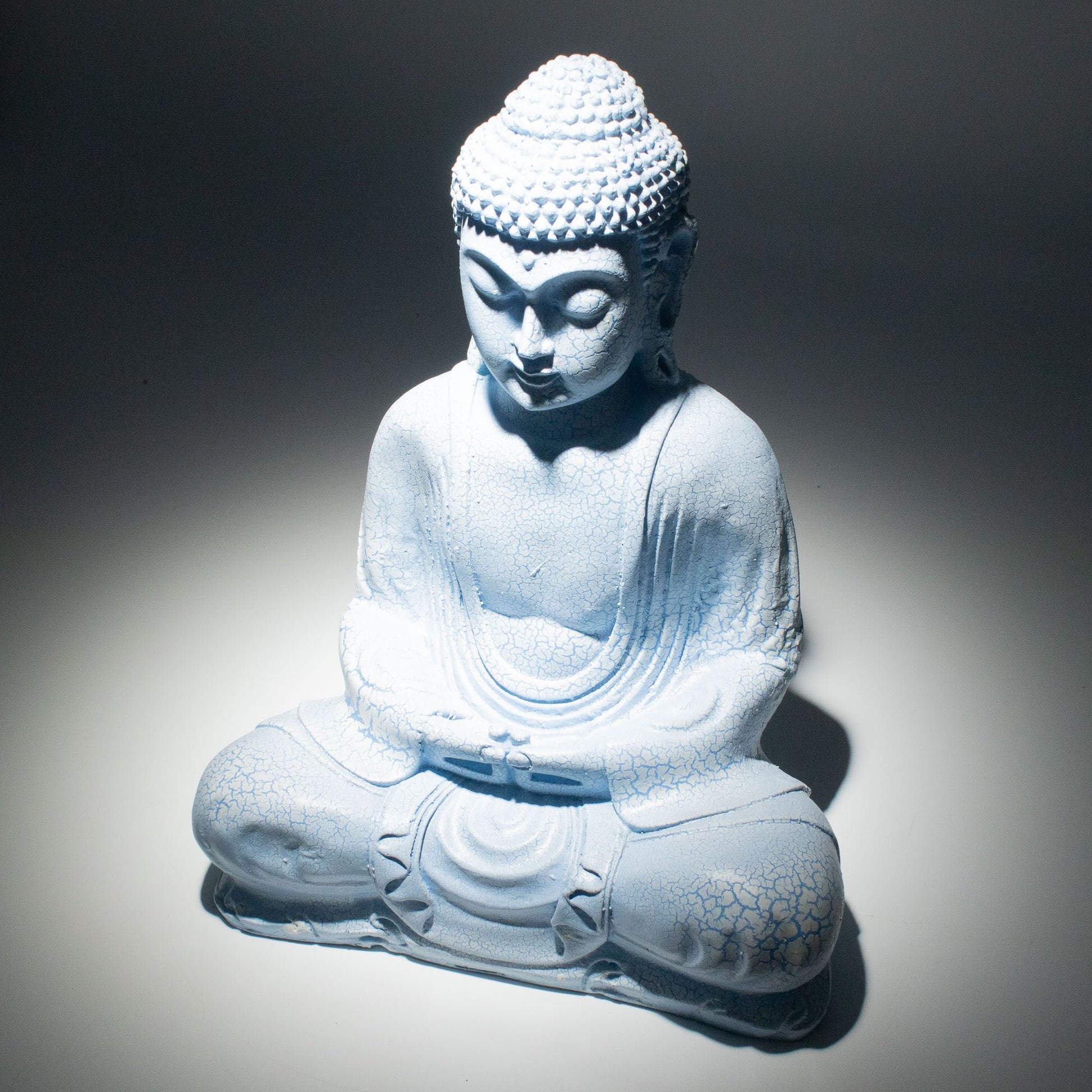 Meditation Buddha Lamp with crackle textured surface on modern oval stand