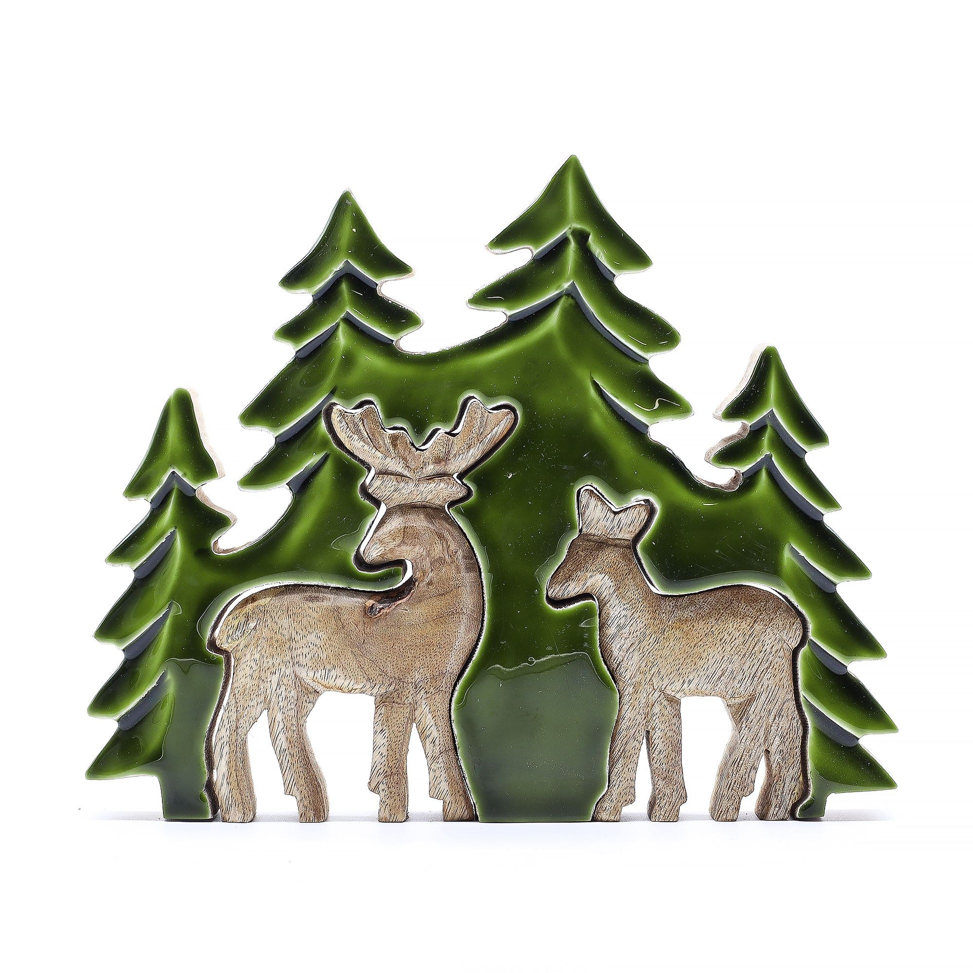 3D mango wood deer in forest decoration with two standing deer, green enamel trees and layered woodland scene on mantel with fairy lights and pine cones