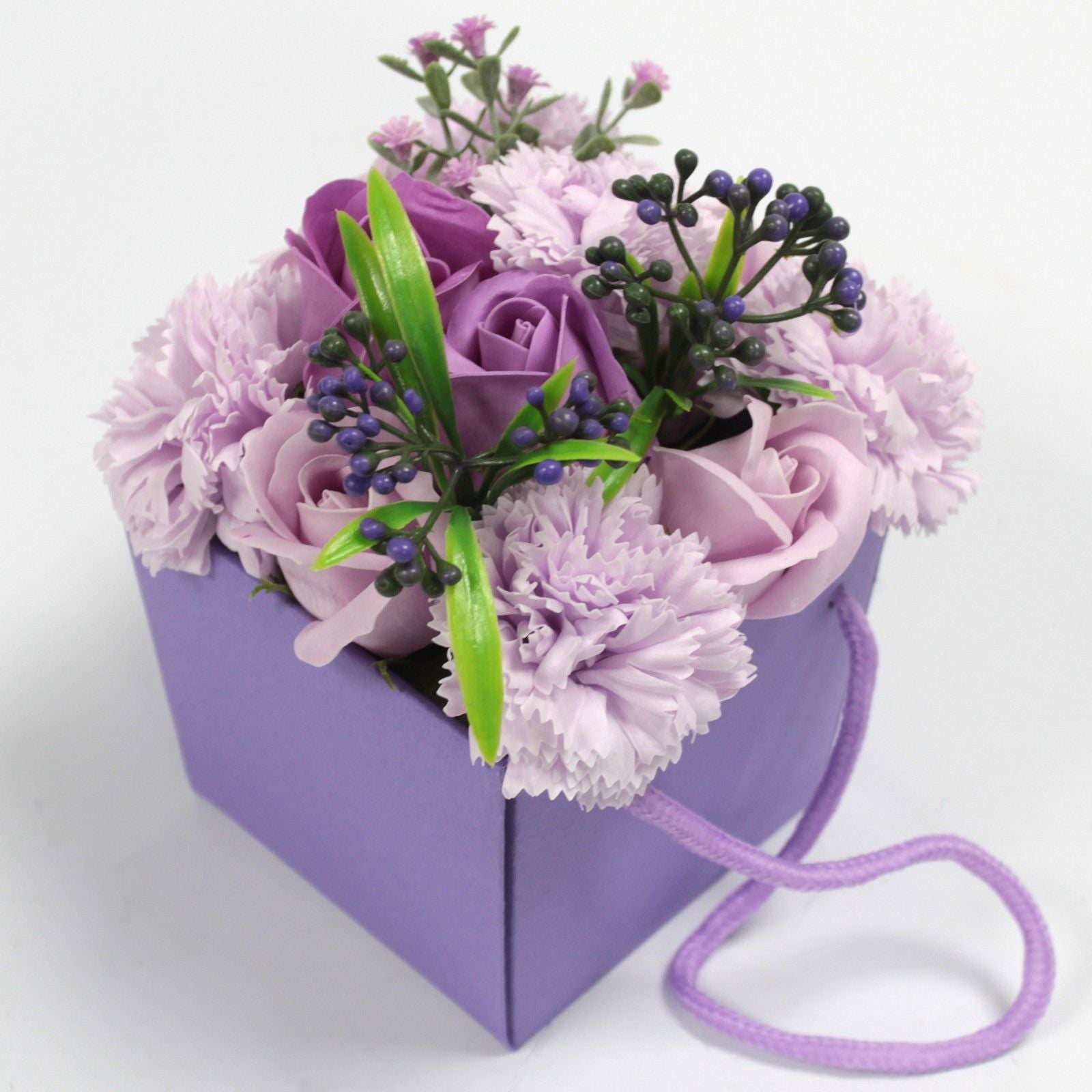 Luxury soap flower bouquet featuring realistic lavender roses and carnations, artistically arranged in elegant gift packaging with ribbon, presented as bath blooms
