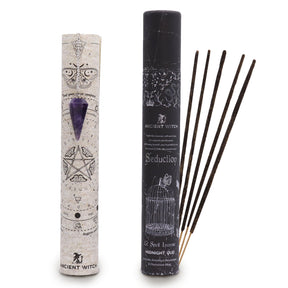 Incense sticks and pendulum with their packaging featuring mystical symbols on a white background