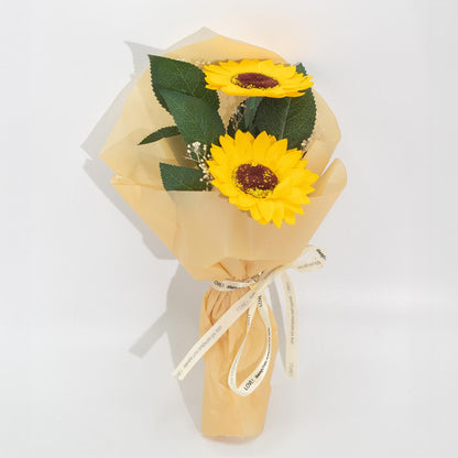 Two Sunflower Soap Flower Bouquet with vibrant yellow petals and delicate white accents, wrapped in elegant paper with ribbon, presented as cheerful bath and décor gift