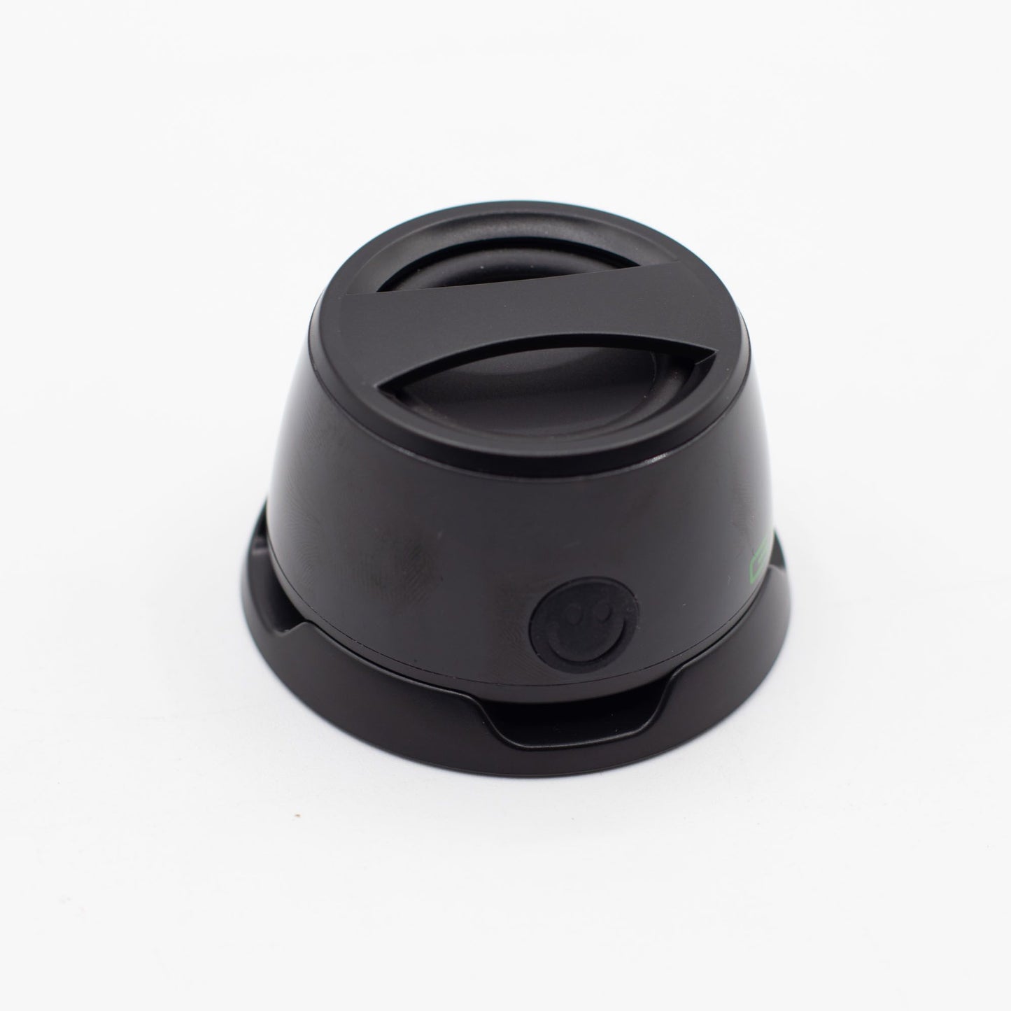 Speaker with included metal ring sticker for non-MagSafe phones, demonstrating universal compatibility