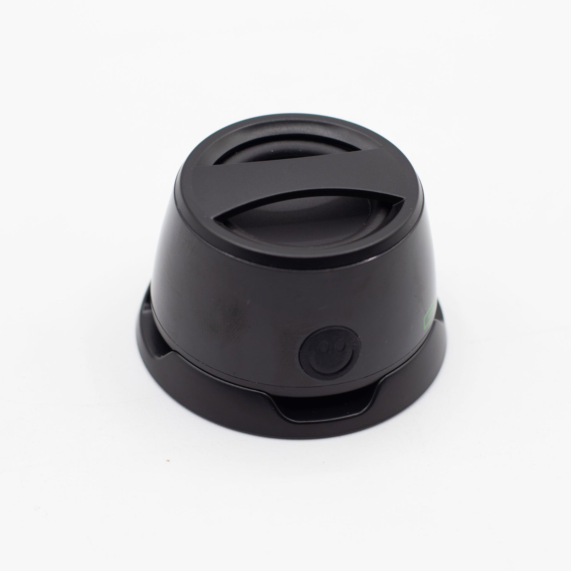 Speaker with included metal ring sticker for non-MagSafe phones, demonstrating universal compatibility