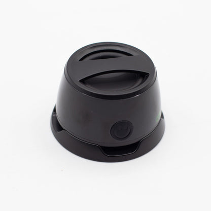 Speaker with included metal ring sticker for non-MagSafe phones, demonstrating universal compatibility
