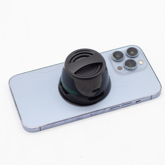 G300 mini speaker snapped onto phone back, propped as stand for hands-free video watching or calls