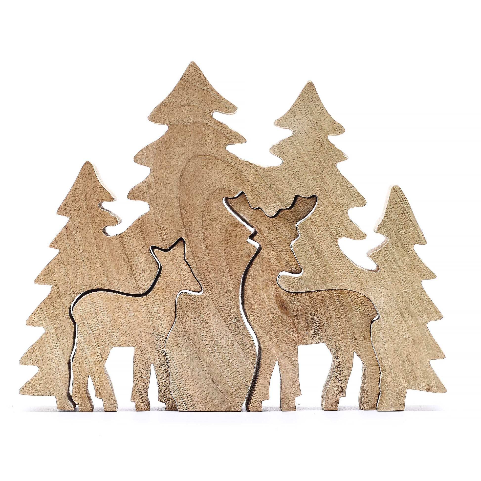 3D mango wood deer in forest decoration with two standing deer, green enamel trees and layered woodland scene on mantel with fairy lights and pine cones