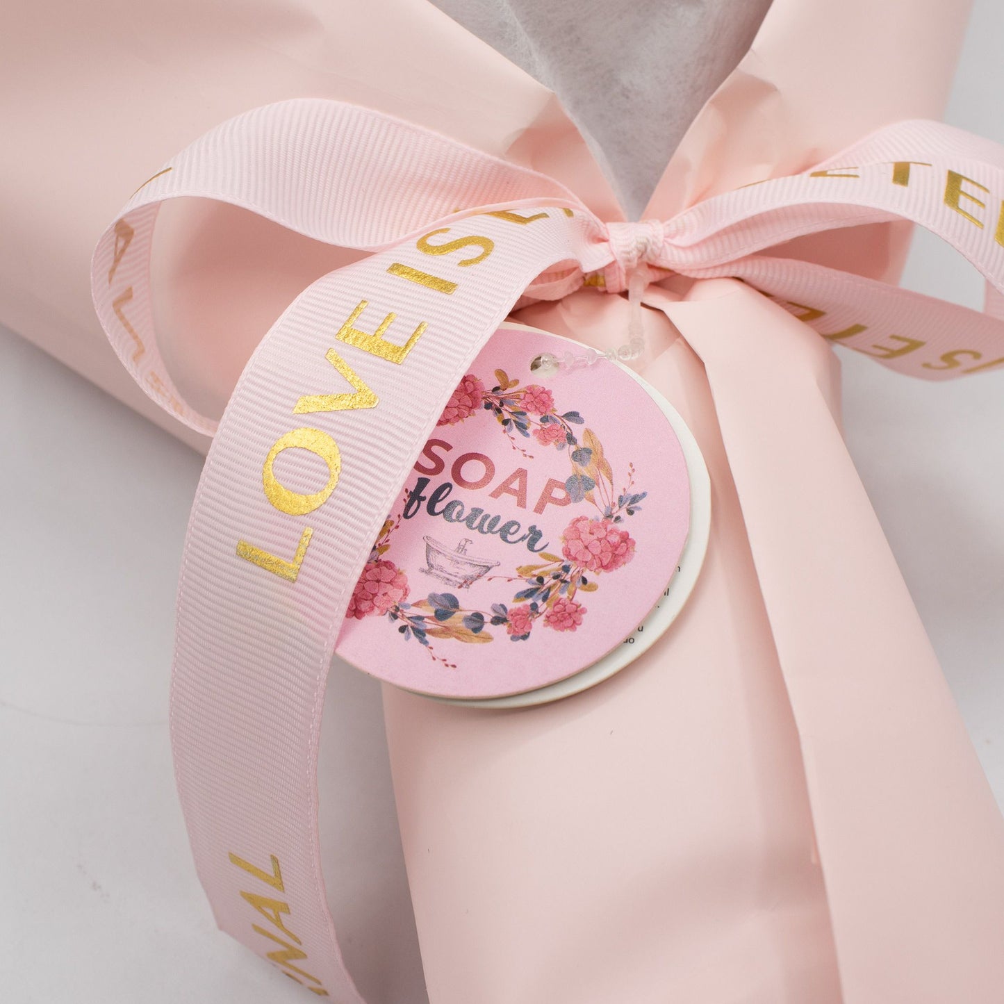 Soap rose bouquet placed beside open gift card with gold heart holder, ready for personal handwritten message